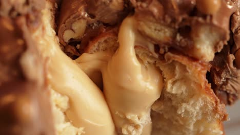 chocolate ferrero donut opened full of cream dripping