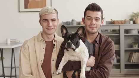 portrait of couple with french bulldog