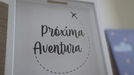 close-up of a funny picture "próxima aventura" as a decoration for a child's room.