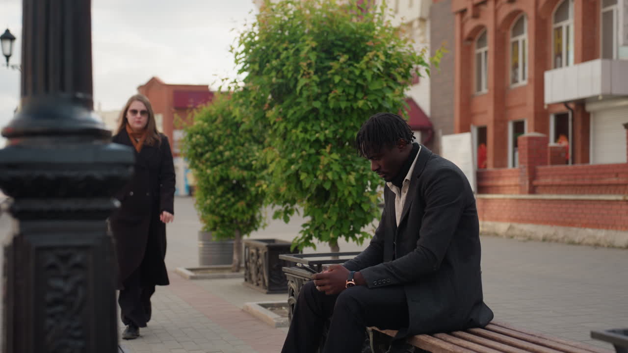 Elegant view of vibrant green foliage in background with wooden pillar standing in front, creating refined composition blending nature and structure, highlighting beauty, color, and balanced scenery