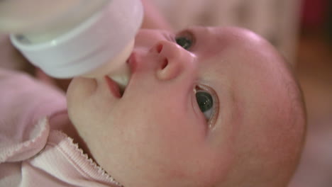 Baby-Being-Fed-With-Bottle-In-Nursery