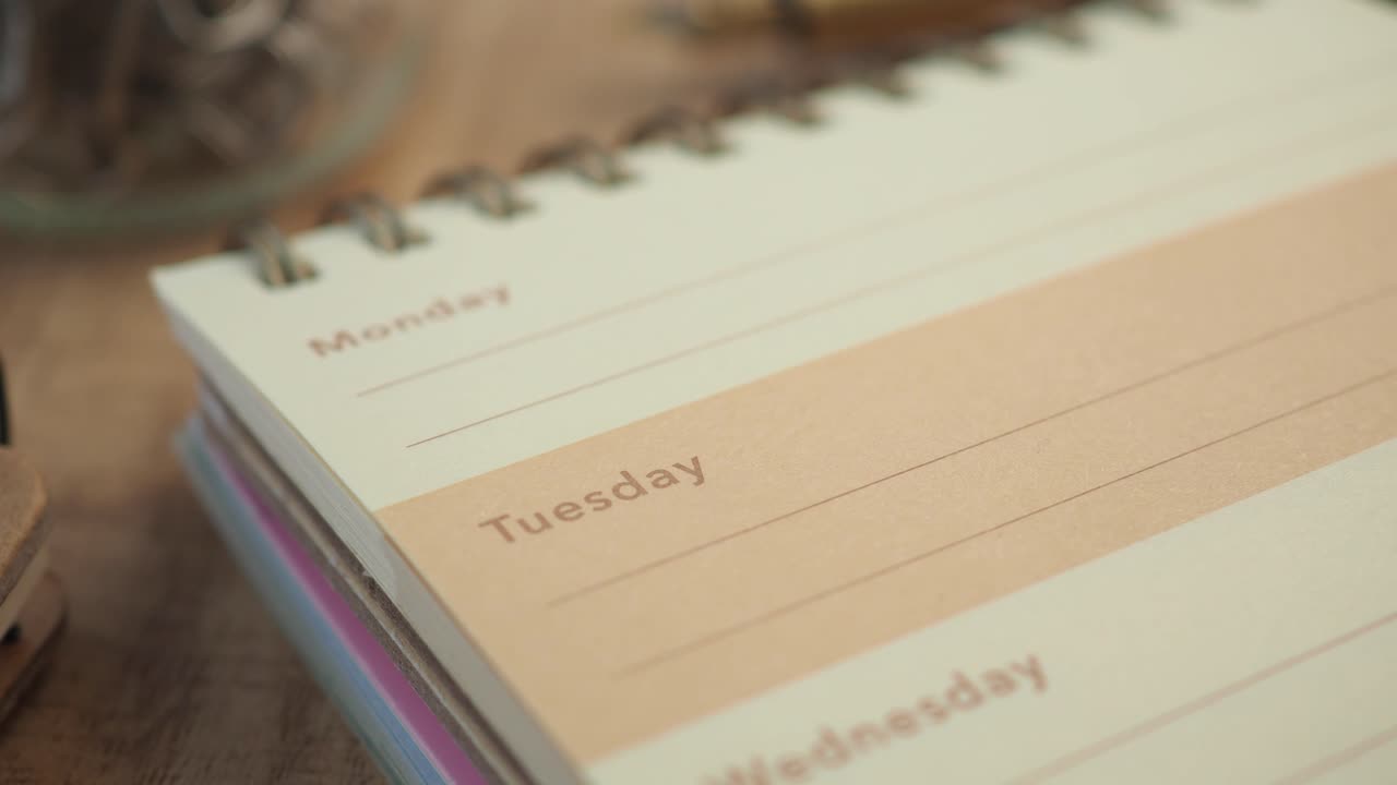 Close-up of a spiral-bound weekly planner