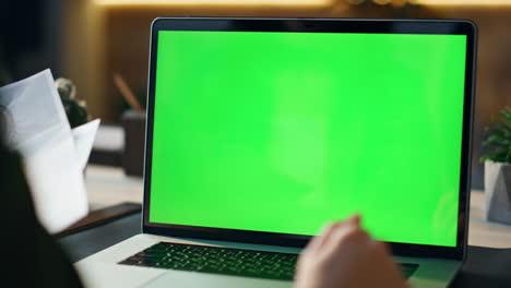 unknown person talking online conference looking laptop green screen close up.