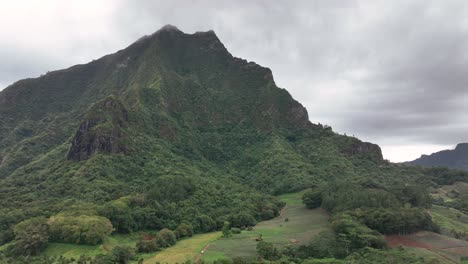 green summit of mont rotui in cloudy sky on the island of moorea, french polynesia