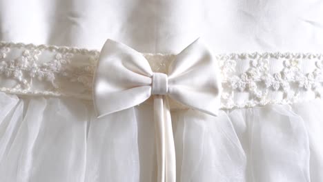 grand white dress, close up bow and lace details