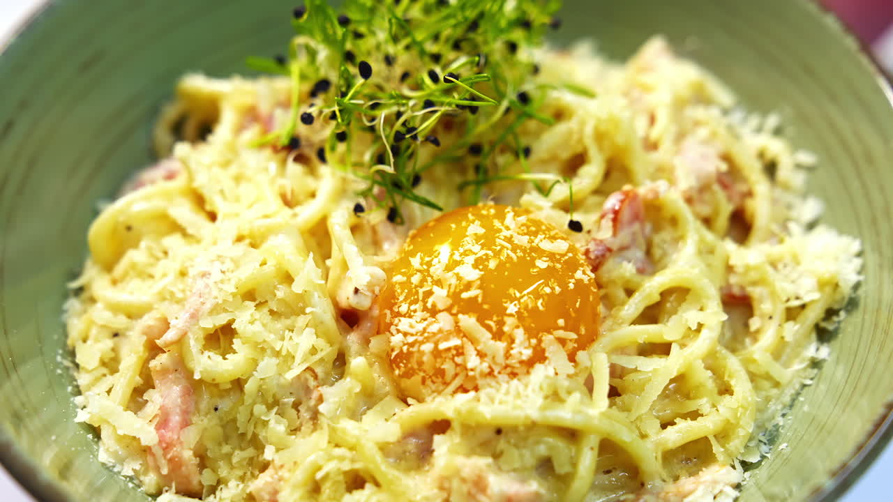 Bowl with salad in beautiful decoration. Diet lunch on a plate. Delicious dish with green sprinkle. Healthy foods with vitamins. Close-up.