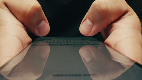 close-up of hands typing on a smartphone