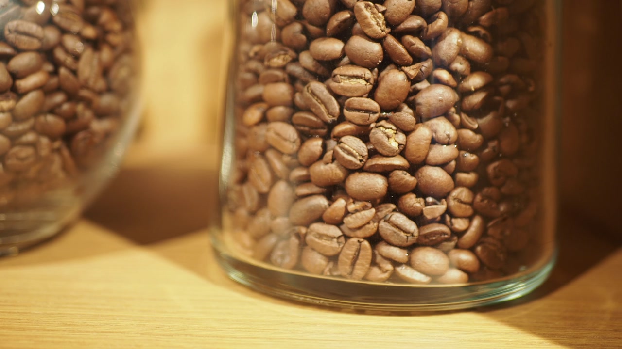 Close-up of Roasted Coffee Beans in a Glass Jar