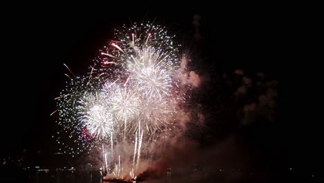 Real-fireworks-exploding-celebration-frame-fill-and-loop-seamlessly-abstract-blur-bokeh-lights-in-the-night-sky-with-the-glowing-fireworks-show-festival