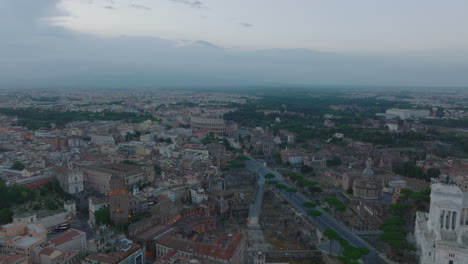 Aerial-panoramic-footage-of-metropolis-at-twilight.-Famous-landmarks-in-historic-city-centre.-Rome,-Italy