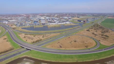 aerial: threeway interchange and highways near goes, the netherlands