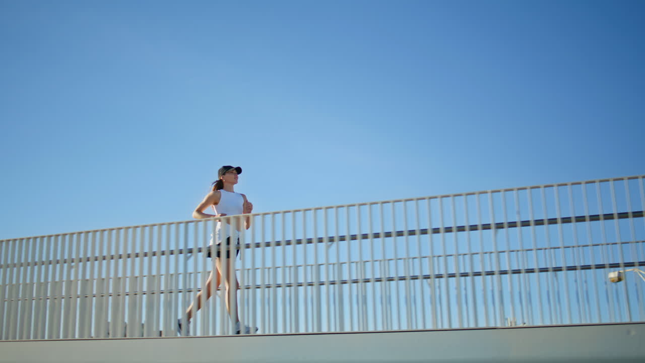 Woman runner enjoy physical activity at summer street. Athletic lady running