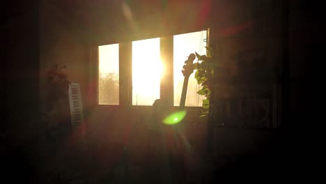 time-lapse of early morning sunrise outside a living room window with lens refraction