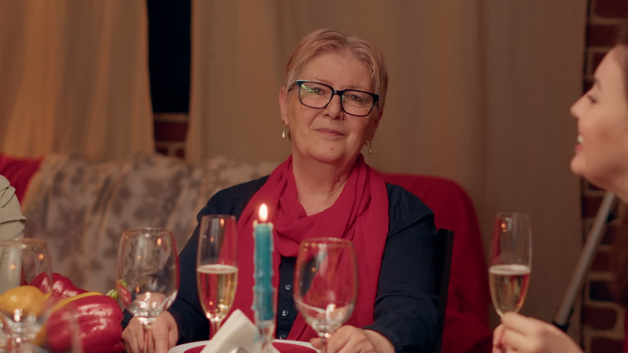 A woman at a dinner party with family