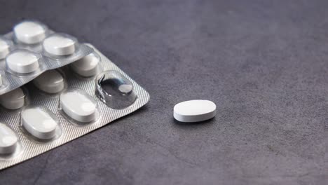 close up of pills of blister pack on table