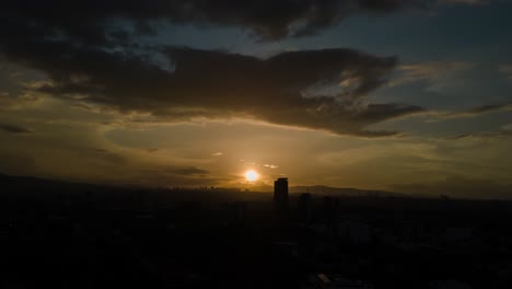 hyperlapse of amazing sunset in middle of mexico city in a cloudy day