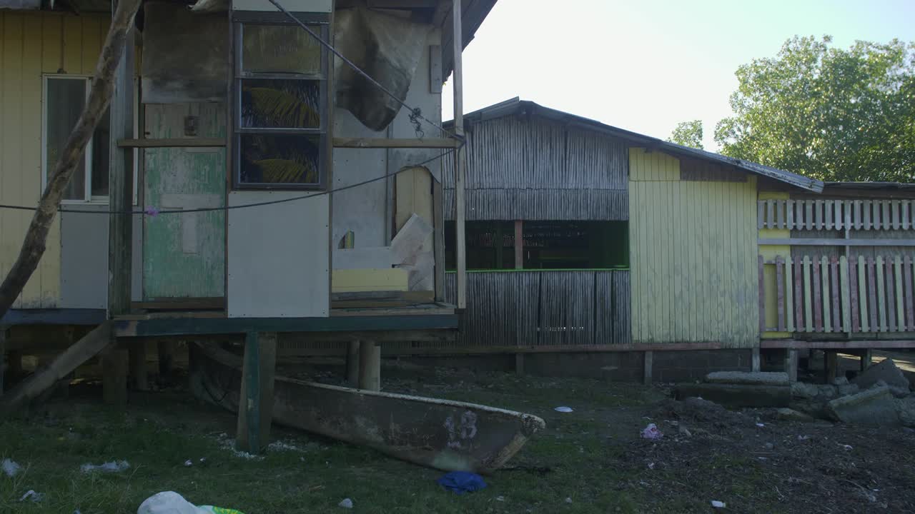 Abandoned and dilapidated beach house in Punta Gorda beach at Roatan, Honduras