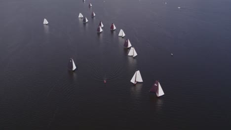 old wooden sail boats at tjeukemeer friesland sailing a race, aerial