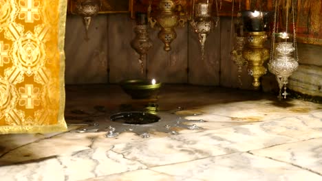 tilt down close up of the star in the church of the nativity, bethlehem