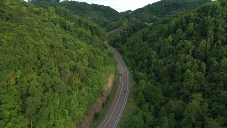 aerial view of freeway and forest near devils bathub and waterfall virginia usa