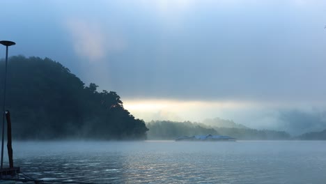 foggy river scene with mountains and sky