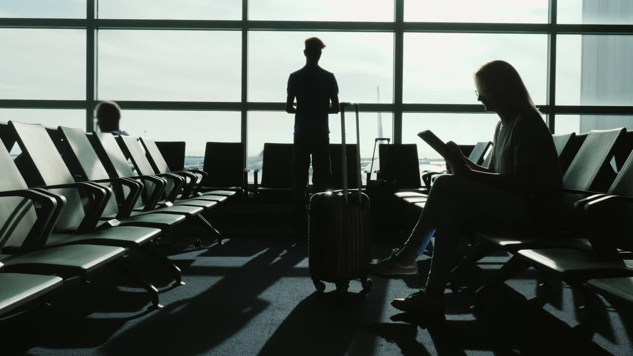 People Waiting For Flight Silhouettes