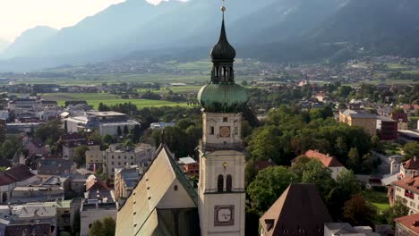 aerial view of mountain town in austria with churches, colorful houses, towers, summer scenery, river austrian alps from above, austria, europe