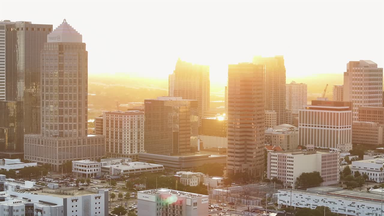 Golden hour over downtown Tampa’s skyscrapers, including prominent office towers and corporate buildings