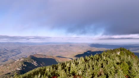 aerial-cresting-the-peak-of-grandfather-mountain,-calloway-peak