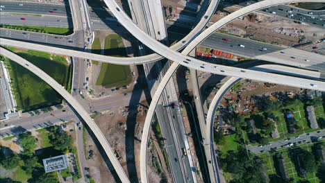 top-down view of complex highway interchange with busy traffic