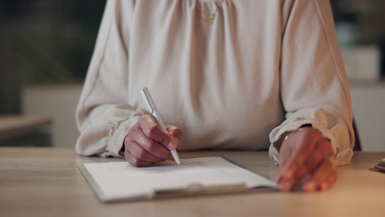 Woman signing a document