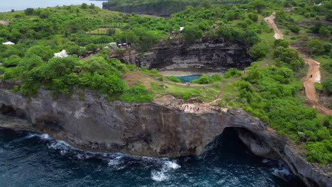 waves crash at broken beach caves in nusa penida indonesia