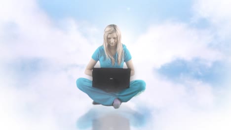 woman up in clouds using laptop