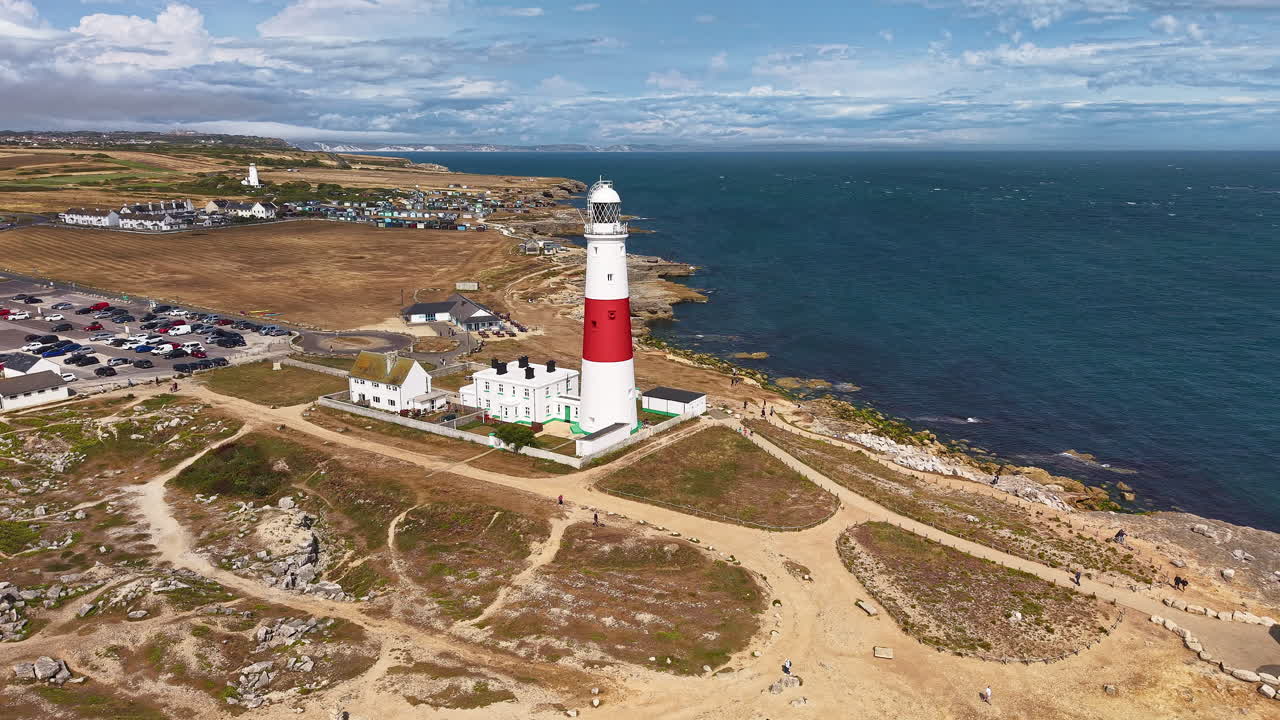 Aerial orbit view of the iconic Portland Bill Lighthouse on the Jurassic Coast, Dorset