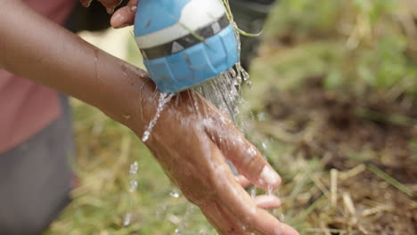 SLOW-MOTION---An-Indian-woman-washes-her-hands-during-gardening