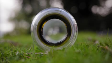 bottom-of-a-glass-bottle-beautiful-circle-on-the-grass