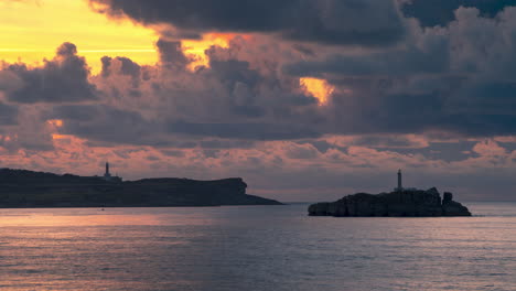 timelapse during sunset of lighthouses in santander