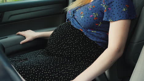 Pregnant-Woman-In-Passenger-Seat-Fastens-Seat-Belt