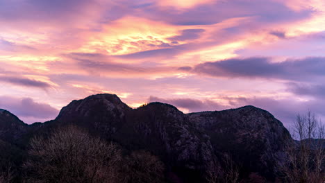 sunrise timelapse: colourful dawn mountain and clouds changing colours with rising sun