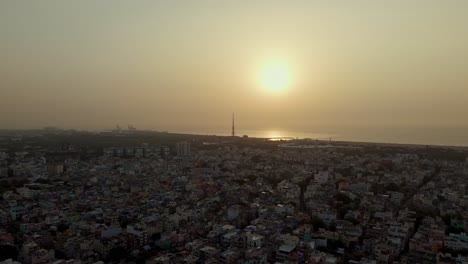 high angle view of sun shining bright on a summer day over a city. cityscape.