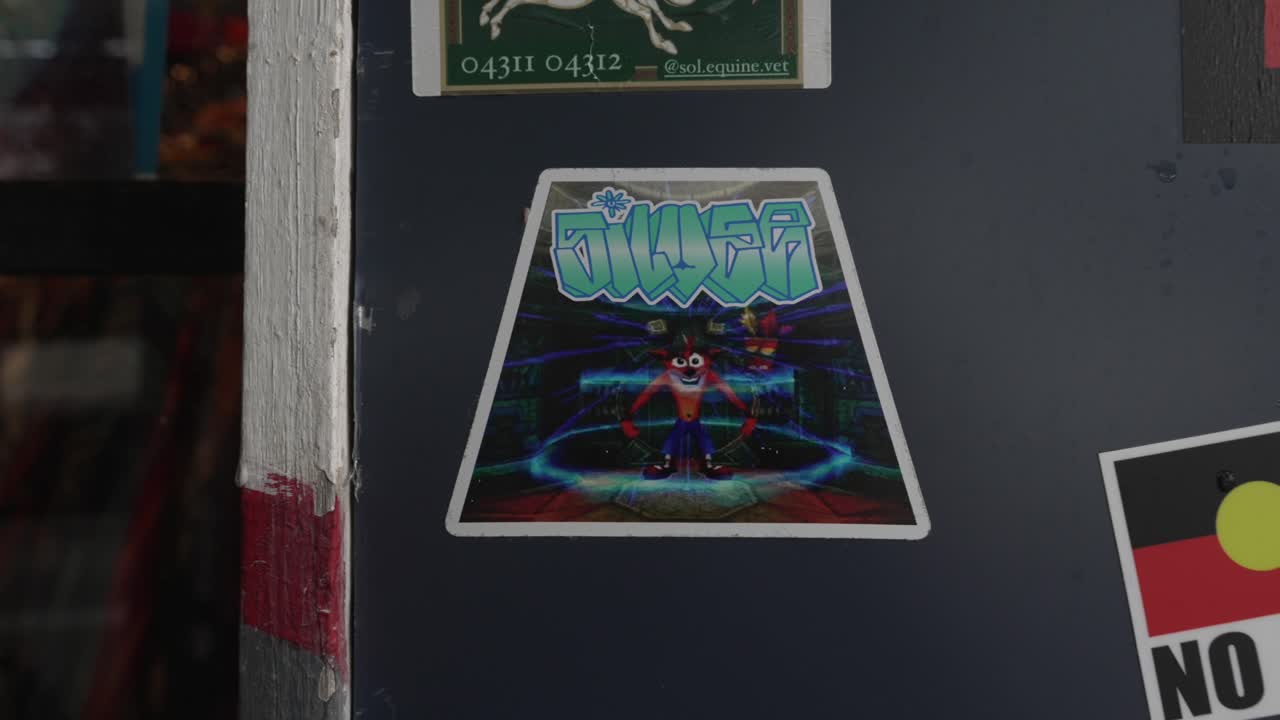 Game sticker player character on grey wall Crash Bandicoot video game