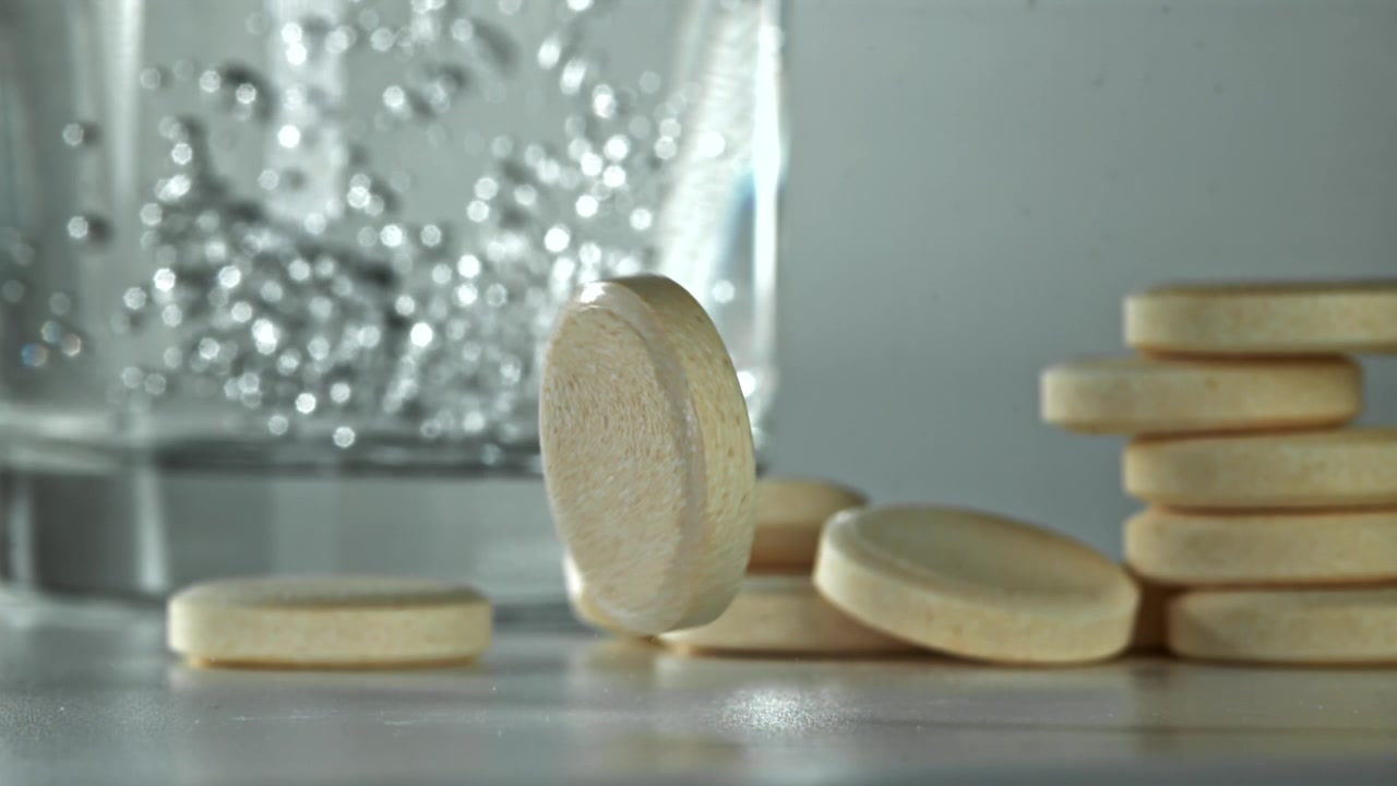 Effervescent Tablet Falling and Bouncing in Slow Motion