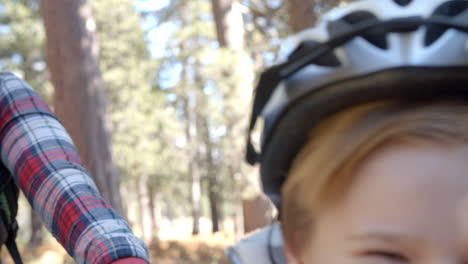 close up shot of family on bikes in a forest