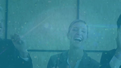 animation of golden confetti falling over diverse businesspeople clapping and celebrating together