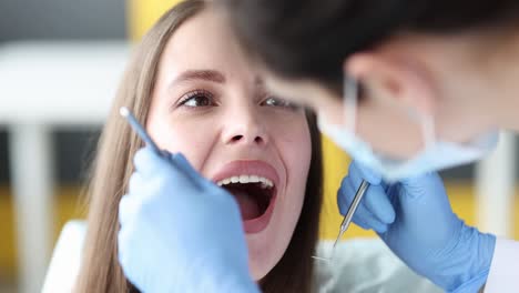 dentist examining a patient's teeth during a dental check-up