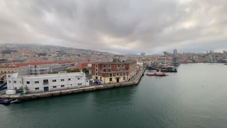 aerial view of genoa, italy heavy storm cloudy sky drone fly above old town and port