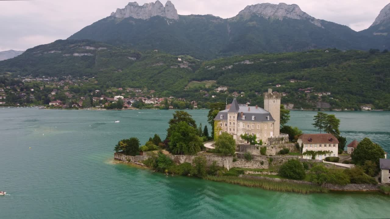 Château de Duingt, a stunning castle on Lake Annecy, France. Footage starts towards the amazing building and then fly over it and rotates to the left revealing the surrounding views of the lake