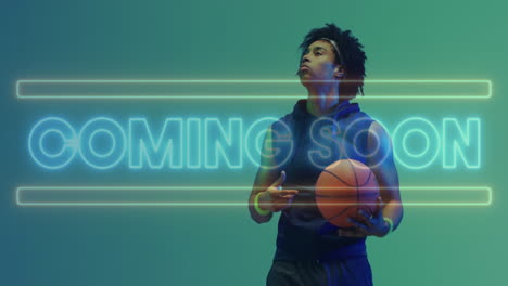 animation of coming soon text in neon over african american male basketball player holding ball