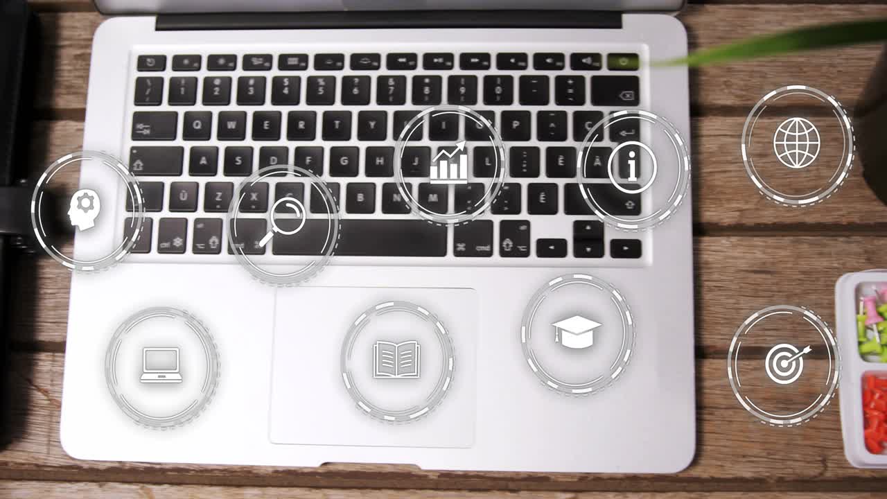 One second after starting digital icons animating onto notebook and laptop showing workflow