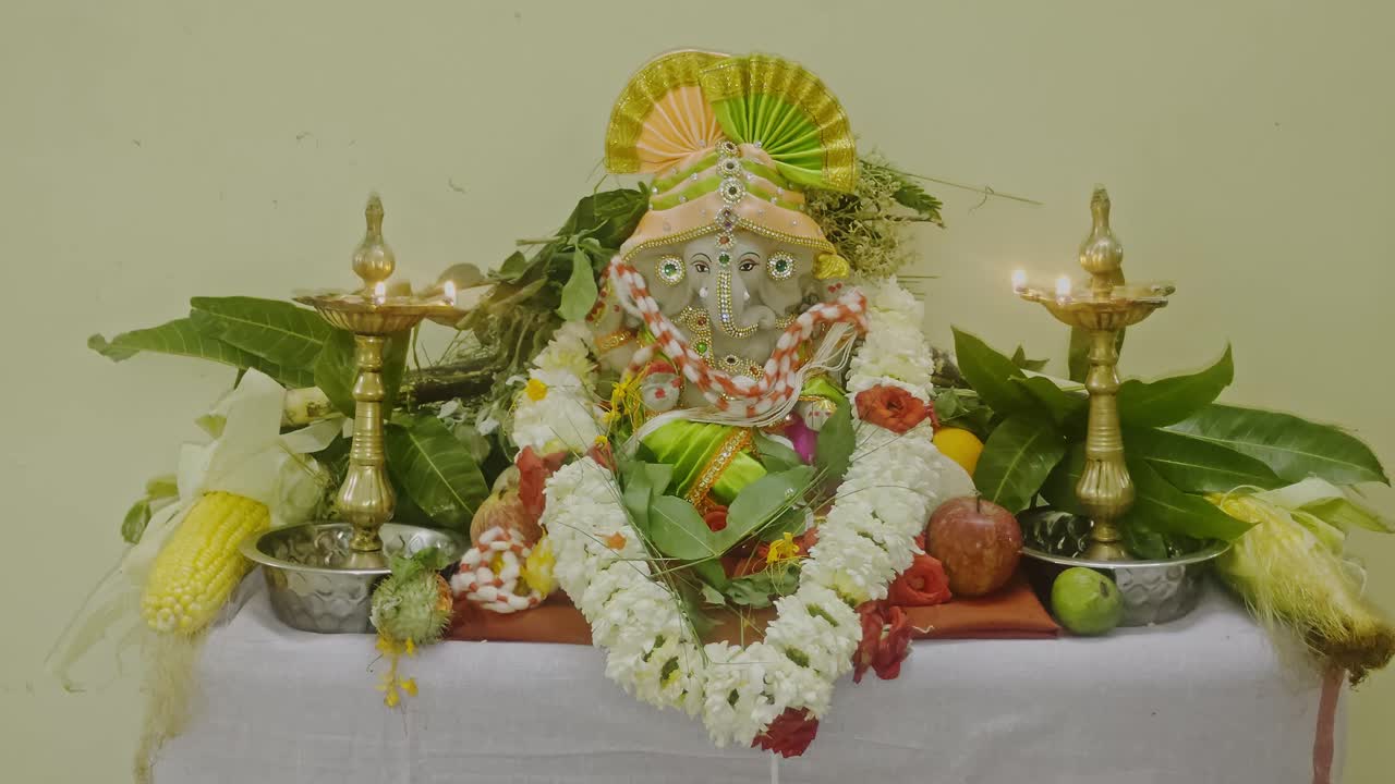 Eco friendly Lord Ganesh Idol with Traditional Offerings and Oil Lamps – Indian Devotional Scene. internal shot, stable shot, 4k